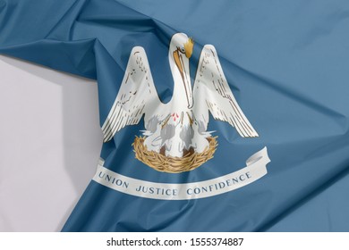 Louisiana Fabric Flag Crepe And Crease With White Space, The States Of America. A Mother Pelican 