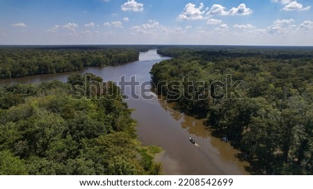 Louisiana Swamp and cypress tree forest with fishing boat afternoon high angle landscape shot