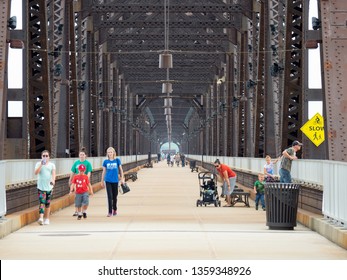 LOUISVILLE, KENTUCKY - AUGUST 18, 2018:  Pedestrians Use The Big Four Footbridge To Walk, Bike And Enjoy The Views