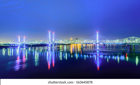 Louisville KY Skyline At Dawn Featuring The Lincoln And Kennedy Bridges .