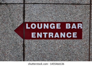 Lounge Bar Entrance. Panel With Arrow On A Marble Wall.