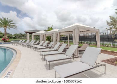 Lounge Chairs With Cabana In A Community Resort Pool