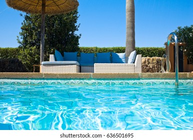 Lounge Chairs Near Pool Side