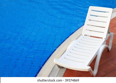 Lounge Chairs In A Swimming Pool Invite You To Relax