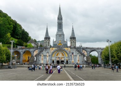 LOURDES, FRANCE - AUGUST 16: Pilgrims in the sanctuary of Our Lady of Lourdes, on August 16, 2021 in Lourdes France