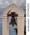 Loutro, Greece - September 18 2024: Belfry of the church of Sotiros Christou at Loutro. Loutro is the small village of the remoute and mountainous region of west Crete, Greece.