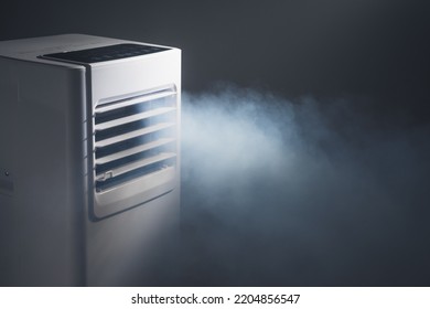 louvers outlet of portable air conditioner with cold steam, close-up view - Shutterstock ID 2204856547