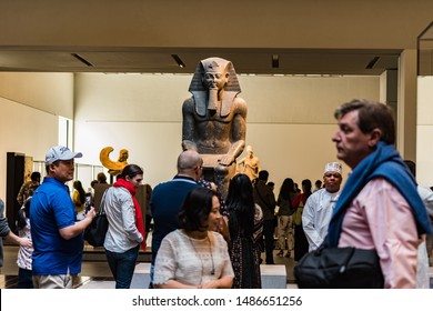 Louvre museum, Saadiyat Island, Abu Dhabi, U.A.E. -November 28th 2018: The bronze statue dating back to 800b.c. of Ramses 11 at the Louvre museum Abu Dhabi visited by people of diverse cultures.
