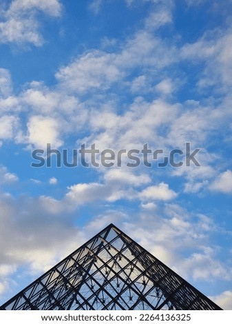 Louvre pyramids to blue sky