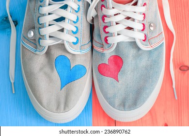  Love background with different jeans shoes and two hearts. - Powered by Shutterstock