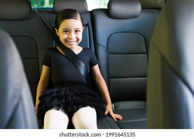 I Love Ballet. Beautiful Little Girl With A Black Skirt Sitting In The Car And Smiling On Her Drive To Her Ballet Dance Lessons