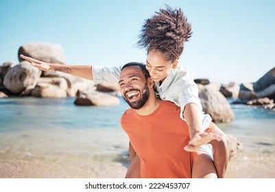Love, beach and man piggy back woman, smile and happy together for romance, holiday and vacation outdoor. Romantic, black couple and bonding being loving, enjoy seaside getaway, laugh or happiness.
