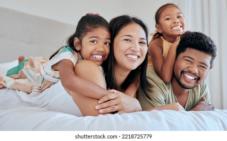 Love, bed and portrait of relax happy family bonding, having fun and enjoy quality time together in Malaysia hotel bedroom. Hospitality, hug and holiday vacation for excited children, dad and mother - Shutterstock ID 2218725779