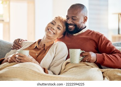 Love, black couple and coffee with blanket, being happy or smile together for bonding, loving and in lounge. Retirement, romance and senior man with mature woman for quality time, talking and connect - Powered by Shutterstock