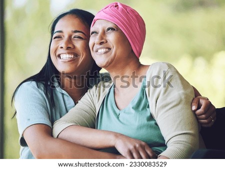 Love, bonding and woman with her mom with cancer hugging, sitting and spending time together. Happy, sweet and sick mature female person embracing her adult daughter with a smile in outdoor garden.