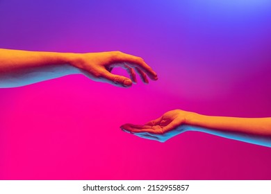 Love  care  Two authentic hands trying to touch each other isolated gradient background in neon light  Concept relationship  community  care  support  symbolism  culture