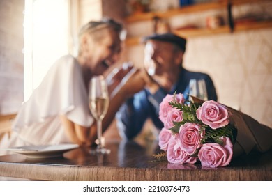 Love, Celebration And Of Roses For Couple Marriage Anniversary With Champagne For Toast. Romantic, Happy And Caring Senior People In Relationship Commitment Together Enjoy Intimate Date.