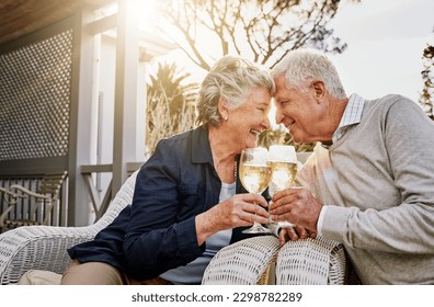 Love, cheers and wine, old couple celebrate romance or anniversary on patio of vacation home. Happiness, senior man and woman touching heads with champagne toast, smile and romantic date on holiday. - Powered by Shutterstock