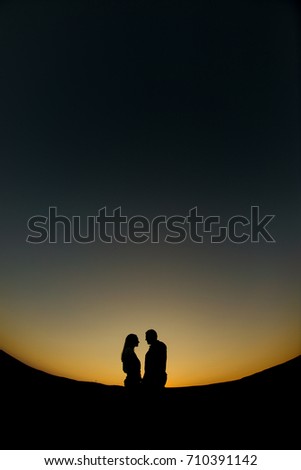 Similar – Two people watching the sunset