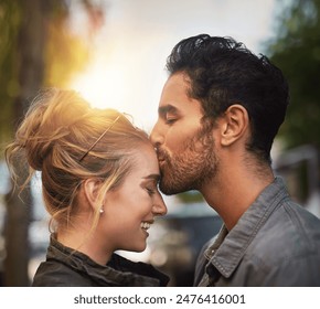 Love, couple and forehead kiss in vacation, adventure and bonding together in California by flare. Happy people, boyfriend and girlfriend in relationship, dating and affection with care outdoor - Powered by Shutterstock