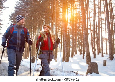 Love couple hiking in forest on winter - Powered by Shutterstock