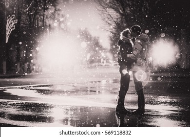 In Love Couple Kissing In The Snow At Night City Street Black And White