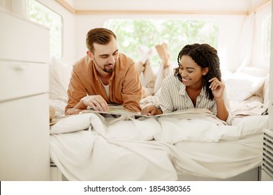 Love Couple Looking On Map In Rv Bed, Trailer