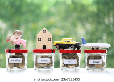 Love couple and model house or property with coins money in the glass bottle on natural green background, Save money for prepare in future and pension retirement concept - Shutterstock ID 2367285433