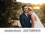 Love, couple and outdoor for wedding day, smile and celebration with romance, loving and bonding. Romantic, man and happy woman with achievement, marriage and countryside for party and commitment