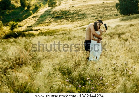 Image, Stock Photo Couple kissing on the field