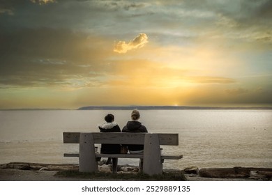 Love couple sitting on bench watching the sunset, back view of Man and woman spending time together. Romantic male and female valentines together. Mixed couple. - Powered by Shutterstock