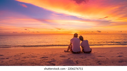 Love couple watching sunset together on beach travel summer holidays. People silhouette from behind sitting enjoying view sunset sea tropical island, destination vacation. Romantic freedom lifestyle - Powered by Shutterstock