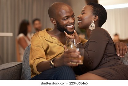 Love, event or couple of friends at a party in celebration of new years drinking wine or whiskey on holiday. Romance, black woman and black man talking, embrace or bonding on a relaxing romantic date - Powered by Shutterstock