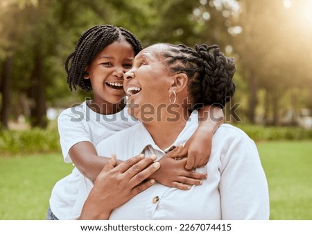 Love, family and child and mature woman hug in nature garden and park for affection hugging. Grandchild, grandmother and loving embrace outside in a green field for bonding in summer yard
