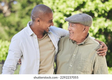 Love, father and adult son outdoor, hug and happiness with bonding, quality time and cheerful. Family, son and dad with a smile, embrace or loving together in nature, park or happy with care or relax - Powered by Shutterstock