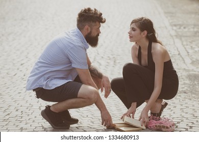 Love at first sight. Man and woman falling in love. Bearded man and cute woman met on street. Hipster helping and looking at pretty girl. Couple in love on summer day. Enjoy romantic date and dating. - Shutterstock ID 1334680913