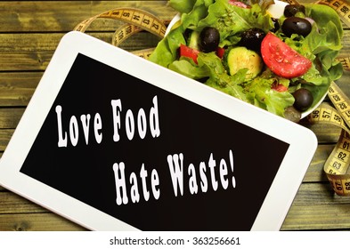 Love Food Hate Waste Written On Digital Tablet