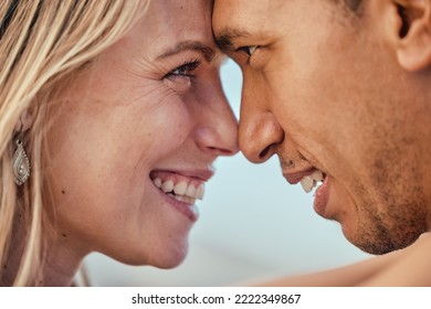 Love, forehead eye contact and diversity couple bond, smile and enjoy romantic quality time together. Marriage partnership, support trust and happy face of black man and woman hug on outdoor date - Powered by Shutterstock