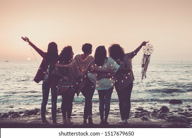 Love Friendship And Celebration Time Concept Image With Group Of Women Friends Viewed From Back Enjoying The Beautiful Coloured Sunset In Front Of The Ocean - Feeling With Nature And Joyful For World