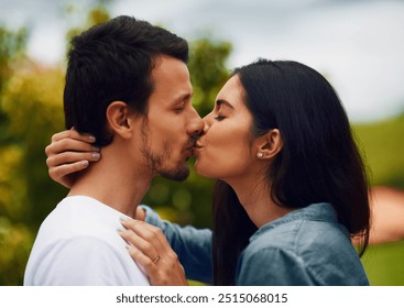 Love, happy and couple kiss in park for bonding, relax together and relationship outdoors. Dating, travel and man and woman with affection for romance on holiday, vacation and weekend in nature - Powered by Shutterstock