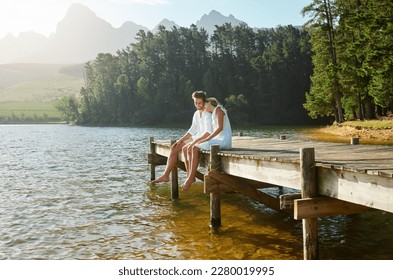 Love, happy and deck with couple at lake for bonding, romance and affectionate date. Nature, travel and holiday with man and woman cuddling on boardwalk in countryside for view, summer and vacation - Powered by Shutterstock