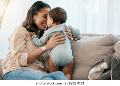 Love, happy and mother with baby on a sofa for playing, games and laughing in their home together. Family, smile and mom with girl toddler on a couch, relax and bonding, fun and hug in a living room - Powered by Shutterstock