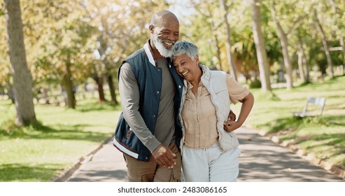 Love, happy and senior couple in park for walk, exercise and fitness in retirement in nature or forest. Partner, diverse and support or trust for man and female person, care and hug or embrace - Powered by Shutterstock