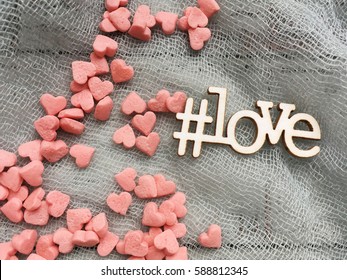 Love Hashtag For Instagram. Hashtag Wooden Love. Love On Grey Textile.  