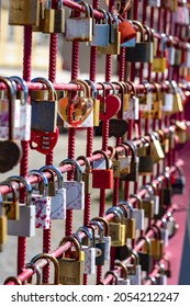 love heart locks on a red fence in Maribor romantic background .