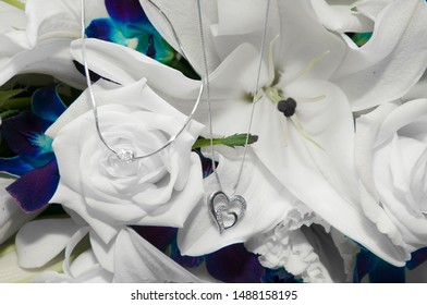 Love heart necklaces on wedding bouquet - Shutterstock ID 1488158195