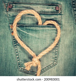 Love Heart Shaped Rope On Denim Jeans Pocket Background. Valentine's Day Card Concept