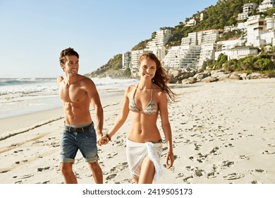 Love, holding hands and couple walking at a beach with freedom, fun and bonding in nature together. Travel, care and happy people at sea for summer, romance or anniversary vacation in South Africa - Powered by Shutterstock