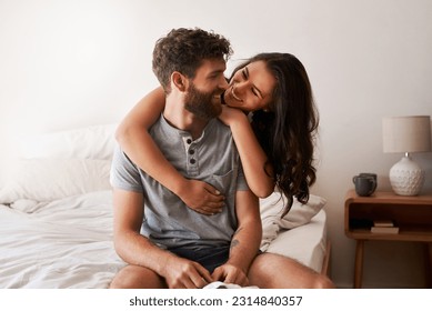 Love, home bedroom and happy couple hug, bond and spending relax morning together, bonding and smile. Happiness, marriage or romantic people hugging with affection, care and enjoy quality time on bed