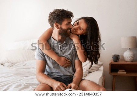 Photo of Love, home bedroom and happy couple hug, bond and spending relax morning together, bonding and smile. Happiness, marriage or romantic people hugging with affection, care and enjoy quality time on bed